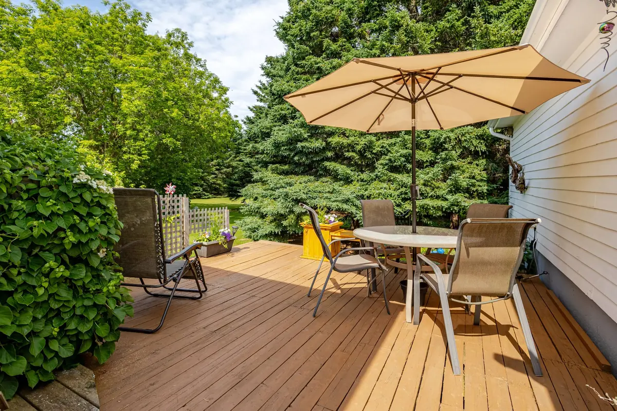 The deck with its table and umbrella